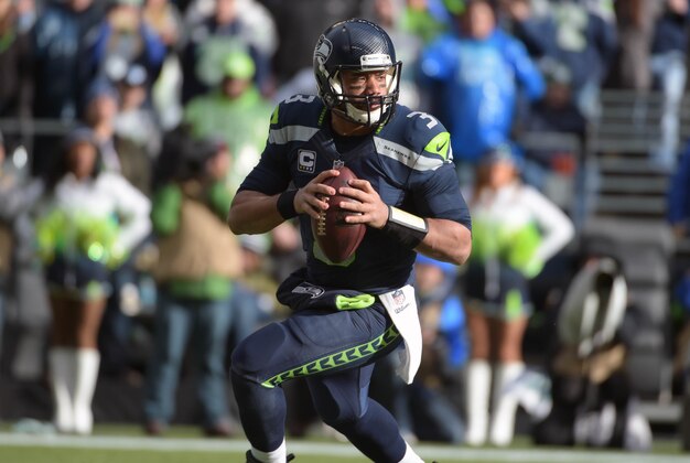 Jan 18, 2015; Seattle, WA, USA; Seattle Seahawks quarterback Russell Wilson (3) looks downfield to throw during the second quarter against the Green Bay Packers in the NFC Championship Game at CenturyLink Field. Mandatory Credit: Kirby Lee-USA TODAY Sports