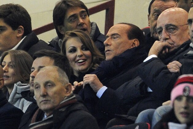 MILAN, ITALY - DECEMBER 04:  Silvio Berlusconi and Francesca Pascale (L) attend the UEFA Champions League group C match between AC Milan and Zenit St Petersburg at San Siro Stadium on December 4, 2012 in Milan, Italy.  (Photo by Claudio Villa/Getty Images)