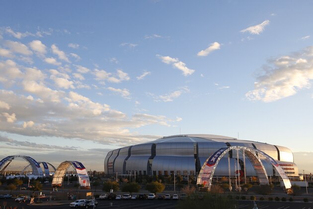 The surrounding area around University of Phoenix Stadium takes shape as the upcoming NFL Super Bowl football game gets closer Tuesday, Jan. 13, 2015, in Glendale, Ariz. (AP Photo/Ross D. Franklin)