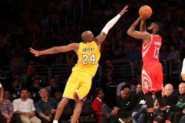 LOS ANGELES, CA - OCTOBER 28: James Harden #13 of the Houston Rockets shoots over Kobe Bryant #24 of the Los Angeles Lakers at Staples Center on October 28, 2014 in Los Angeles, California.  NOTE TO USER: User expressly acknowledges and agrees that, by downloading and or using this photograph, User is consenting to the terms and conditions of the Getty Images License Agreement.  (Photo by Stephen Dunn/Getty Images)