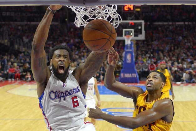 Los Angeles Clippers center DeAndre Jordan, left, dunks the ball as Cleveland Cavaliers center Tristan Thompson defends during the second half of an NBA basketball game, Friday, Jan. 16, 2015, in Los Angeles. The Cavaliers won 126-121. (AP Photo/Mark J. Terrill)