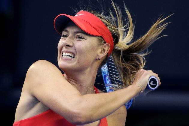Maria Sharapova of Russia follows through on a shot to Zarina Diyas of Kazakhstan during their third round match at the Australian Open tennis championship in Melbourne, Australia, Friday, Jan. 23, 2015. (AP Photo/Bernat Armangue)