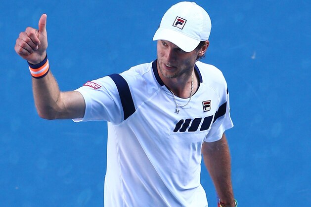 MELBOURNE, AUSTRALIA - JANUARY 23:  Andreas Seppi of Italy celebrates winning his third round match against Roger Federer of Switzerland during day five of the 2015 Australian Open at Melbourne Park on January 23, 2015 in Melbourne, Australia.  (Photo by Cameron Spencer/Getty Images)
