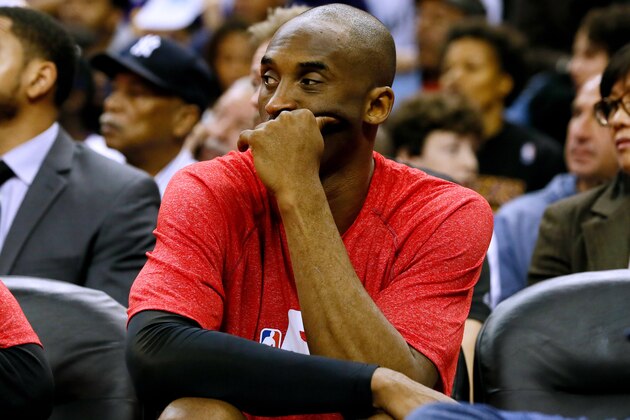 Los Angeles Lakers guard Kobe Bryant sits on the bench during the first half of an NBA basketball game, Wednesday, Jan. 21, 2015, in New Orleans. Bryant tore his right rotator cuff in the Los Angeles Lakers' latest defeat, the club announced Thursday. Bryant injured his right shoulder in the second half of the Lakers' loss at New Orleans on Wednesday night when he drove the baseline for a two-handed dunk. (AP Photo/Jonathan Bachman)