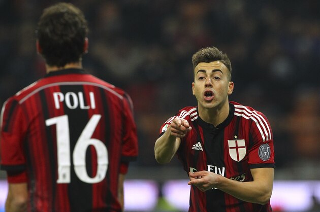 MILAN, ITALY - JANUARY 13:  Stephan El Shaarawy (R) of AC Milan speaks to his team-mate Andrea Poli (L) during the TIM Cup match between AC Milan and US Sassuolo Calcio at Stadio Giuseppe Meazza on January 13, 2015 in Milan, Italy.  (Photo by Marco Luzzani/Getty Images)