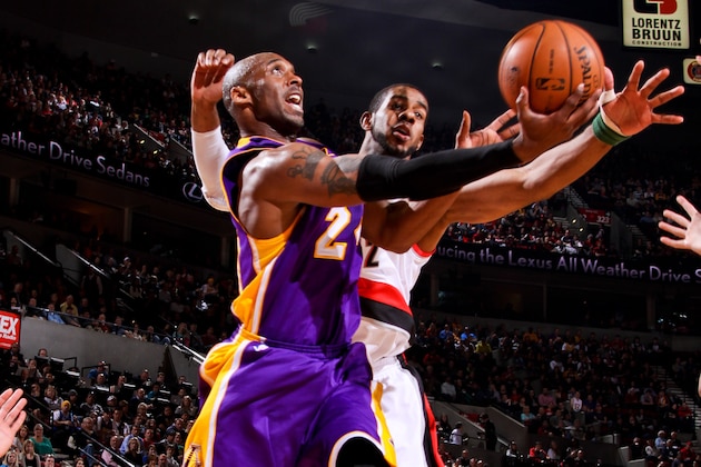 PORTLAND, OR - APRIL 10: Kobe Bryant #24 of the Los Angeles Lakers attempts a reverse layup against LaMarcus Aldridge #12 of the Portland Trail Blazers on April 10, 2013 at the Rose Garden Arena in Portland, Oregon. NOTE TO USER: User expressly acknowledges and agrees that, by downloading and or using this photograph, user is consenting to the terms and conditions of the Getty Images License Agreement. Mandatory Copyright Notice: Copyright 2013 NBAE (Photo by Sam Forencich/NBAE via Getty Images)