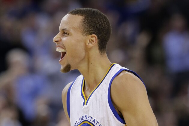 Golden State Warriors guard Stephen Curry (30) celebrates after scoring against the Houston Rockets during the first half of an NBA basketball game in Oakland, Calif., Wednesday, Jan. 21, 2015. (AP Photo/Jeff Chiu)
