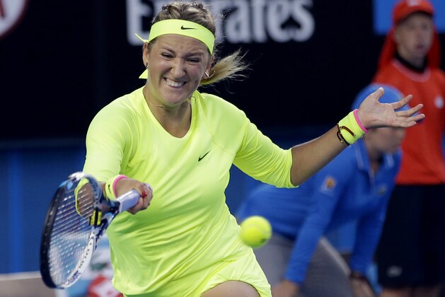 Victoria Azarenka of Belarus makes a forehand return to Caroline Wozniacki of Denmark during their second round match at the Australian Open tennis championship in Melbourne, Australia, Thursday, Jan. 22, 2015. (AP Photo/Lee Jin-man)
