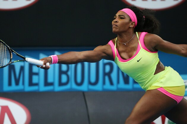 Serena Williams of the U.S. makes a forehand return to Alison Van Uytvanck of Belgium during their first round match at the Australian Open tennis championship in Melbourne, Australia, Tuesday, Jan. 20, 2015. (AP Photo/Rob Griffith)