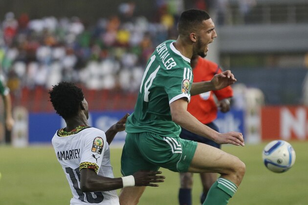 Algeria’s Nabil Bentaleb, right, is challenged by Ghana’s Daniel Amartey during their African Cup of Nations Group C soccer match between Algeria and Ghana in Mongomo, Equatorial Guinea, Friday Jan. 23, 2015. (AP Photo/Themba Hadebe)