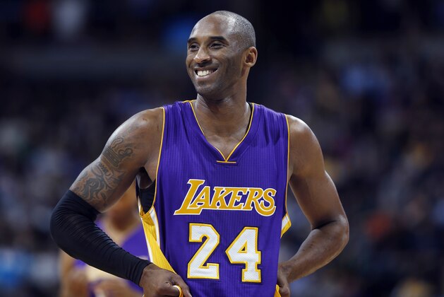 Los Angeles Lakers guard Kobe Bryant stands on the court during a review in the fourth quarter of an NBA basketball game against the Denver Nuggets, Tuesday, Dec. 30, 2014, in Denver. Bryant was given three free throw shots on the play after review and the Lakers held off the Nuggets to post a 111-103 victory. (AP Photo/David Zalubowski)