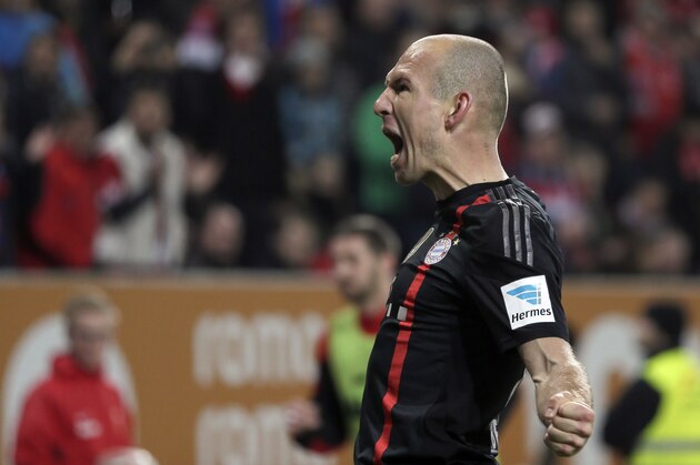 Bayern's Arjen Robben from the Netherlands celebrates after scoring his side's second goal during the German first division Bundesliga soccer match between FC Augsburg and FC Bayern Munich in the SGL Arena in Augsburg, Germany, on Saturday, Dec. 13, 2014. (AP Photo/Matthias Schrader)