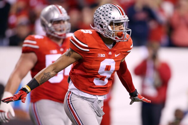 Dec 6, 2014; Indianapolis, IN, USA; Ohio State Buckeyes wide receiver Devin Smith (9) celebrates catching a pass in the end zone for a touchdown against the Wisconsin Badgers during the Big Ten football championship game at Lucas Oil Stadium. Mandatory Credit: Brian Spurlock-USA TODAY Sports