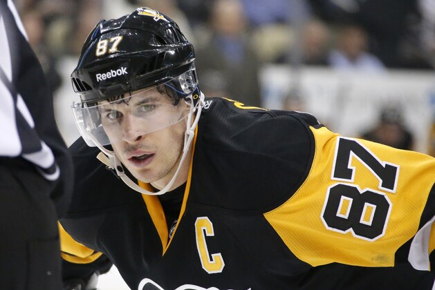 Pittsburgh Penguins' Sidney Crosby (87) prepares to take a face-off during the second period of an NHL hockey game against the Chicago Blackhawks in Pittsburgh, Wednesday, Jan. 21, 2015. (AP Photo/Gene J. Puskar)