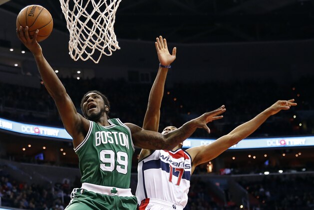 Boston Celtics forward Jae Crowder (99) shoots the ball in front of Washington Wizards guard Garrett Temple (17) in the second half of an NBA basketball game, Saturday, Dec. 27, 2014, in Washington. The Wizards won 101-88. (AP Photo/Alex Brandon)