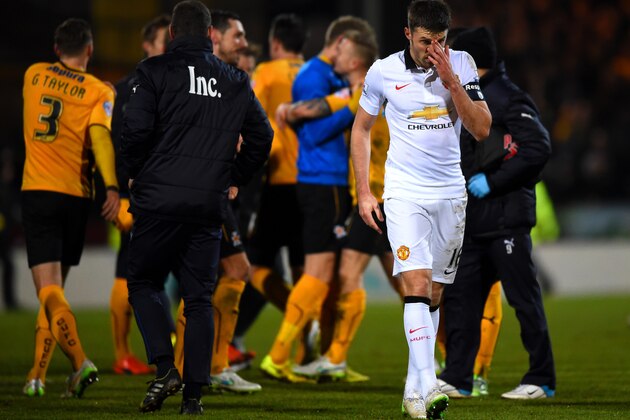 CAMBRIDGE, ENGLAND - JANUARY 23:  Michael Carrick of Manchester United reacts as Cambridge United players celebrate during the FA Cup Fourth Round match between Cambridge United and Manchester United at The R Costings Abbey Stadium on January 23, 2015 in Cambridge, England.  (Photo by Shaun Botterill/Getty Images)