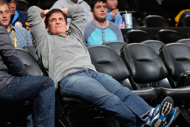 DENVER, CO - JANUARY 14:  Mark Cuban, owner of the Dallas Mavericks, sits courtside as his team warms up prior to facing the Denver Nuggets at Pepsi Center on January 14, 2015 in Denver, Colorado. NOTE TO USER: User expressly acknowledges and agrees that, by downloading and or using this photograph, User is consenting to the terms and conditions of the Getty Images License Agreement.  (Photo by Doug Pensinger/Getty Images)