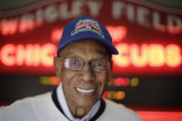 FILE - In this March 24, 2014, file photo Chicago Cubs Hall of Fame slugger Ernie Banks smiles after an interview at the Cubs offices in Chicago. The Cubs announced Friday night, Jan. 23, 2015, that Banks had died. He was 83. (AP Photo/M. Spencer Green, File)