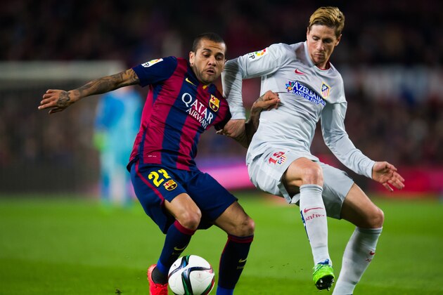 BARCELONA, SPAIN - JANUARY 21: Dani Alves of FC Barcelona fights for the ball with Fernando Torres of Club Atletico de Madrid during the Copa del Rey Quarter-Final First Leg match between FC Barcelona and Club Atletico de Madrid at Camp Nou on January 21, 2015 in Barcelona, Spain. (Photo by Alex Caparros/Getty Images) BARCELONA, SPAIN - JANUARY 21: Dani Alves of FC Barcelona fights for the ball with Fernando Torres of Club Atletico de Madrid during the Copa del Rey Quarter-Final First Leg match between FC Barcelona and Club Atletico de Madrid at Camp Nou on January 21, 2015 in Barcelona, Spain. (Photo by Alex Caparros/Getty Images)