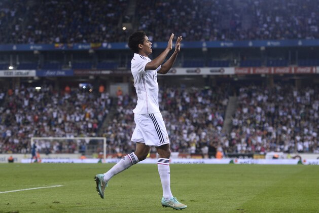 Real Madrid's Raphael Varane reacts after scoring his second goal against Cornella during a Copa del Rey soccer match in Cornella Llobregat, Spain, Wednesday, Oct. 29, 2014. (AP Photo/Manu Fernandez)