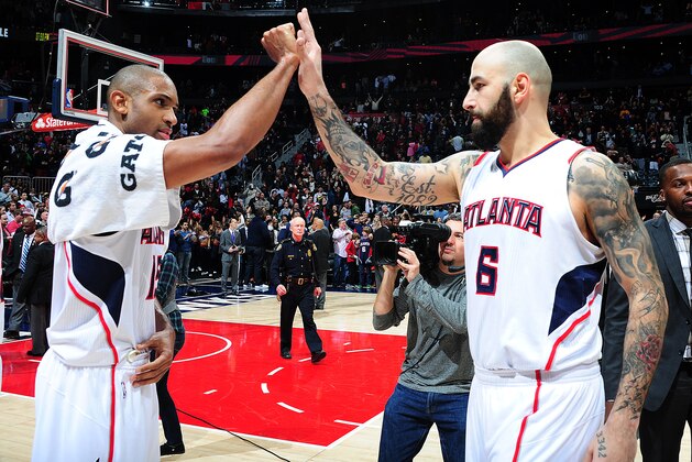 ATLANTA, GA - JANUARY 23: Al Horford #15 of the Atlanta Hawks celebrates with Pero Antic #6 after the game against the Oklahoma City Thunder on January 23, 2015 at Philips Arena in Atlanta, Georgia.  NOTE TO USER: User expressly acknowledges and agrees that, by downloading and/or using this Photograph, user is consenting to the terms and conditions of the Getty Images License Agreement. Mandatory Copyright Notice: Copyright 2015 NBAE (Photo by Scott Cunningham/NBAE via Getty Images)