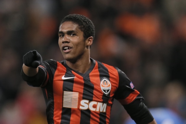 Shakhtar Donetsk's Douglas Costa  celebrates after scoring during the Champions League group A soccer match between Real Sociedad and FC Shakhtar Donetsk at the Donbas Arena stadium in Donetsk, Ukraine, Ukraine, Wednesday, Nov. 27, 2013. (AP Photo/Efrem Lukatsky)