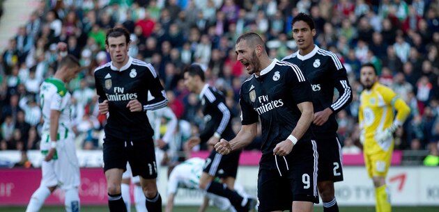 Real Madrid's Gareth Bale, right, and Cordoba's Edimar Fraga fight for the ball during their La Liga soccer match at the Arcangel stadium, in Cordoba, Spain on Saturday, Jan. 24, 2015. (AP Photo/Miguel Morenatti)