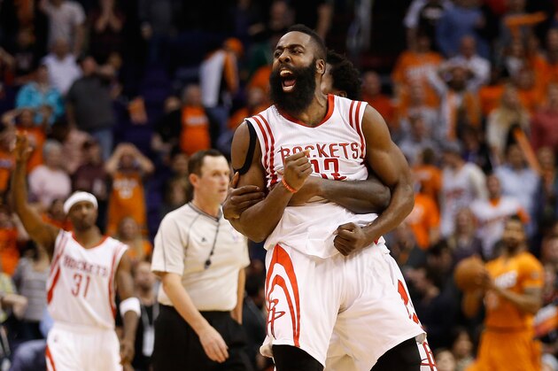 PHOENIX, AZ - JANUARY 23:  James Harden #13 of the Houston Rockets celebrates after making the game winning shot to defeat the Phoenix Suns during the final seconds of the NBA game at US Airways Center on January 23, 2015 in Phoenix, Arizona.  The Rockets defeated the Suns 113-111.  NOTE TO USER: User expressly acknowledges and agrees that, by downloading and or using this photograph, User is consenting to the terms and conditions of the Getty Images License Agreement.  (Photo by Christian Petersen/Getty Images)