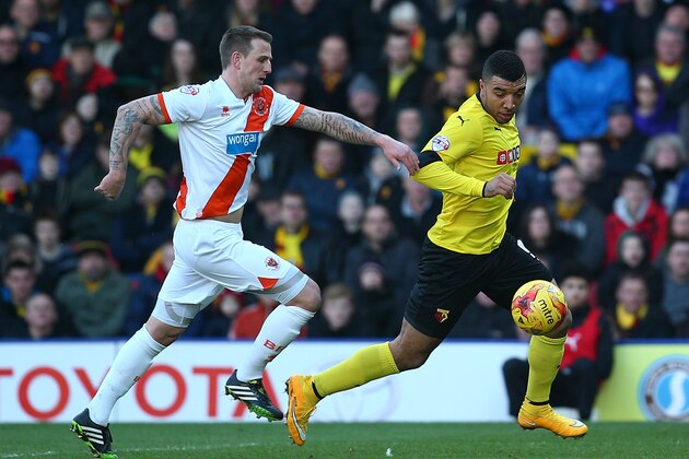 WATFORD, ENGLAND - JANUARY 24: Troy Deeney of Watford looks to get past Peter Clarke of Blackpool during the Sky Bet Championship match between Watford and Blackpool at Vicarage Road on January 24, 2015 in Watford, England. (Photo by Charlie Crowhurst/Getty Images)