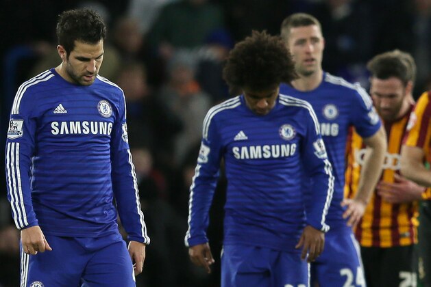 Chelsea’s Cesc Fabregas, center left, and Chelsea’s Willian, center right, look dejected during the English FA Cup 4th round soccer match between Bradford City and Chelsea at Stamford Bridge, London, England, Saturday, Jan. 24, 2015. (AP Photo/Tim Ireland)