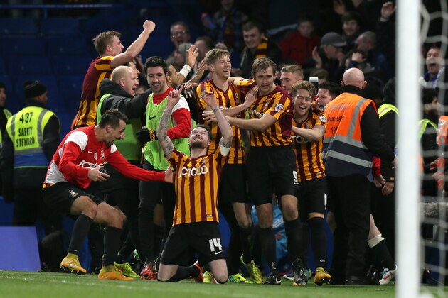 Bradford’s Mark Yeates, centre, celebrates after scoring a goal during the English FA Cup 4th round soccer match between Bradford City and Chelsea at Stamford Bridge, London, England, Saturday, Jan. 24, 2015. Bradford won the match 4-2. (AP Photo/Tim Ireland)