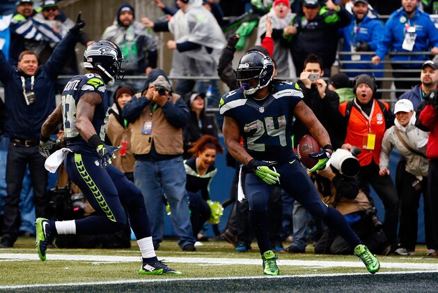 SEATTLE, WA - JANUARY 18:  Marshawn Lynch #24 of the Seattle Seahawks gestures after scoring a touchdown against the Green Bay Packers during the 2015 NFC Championship game at CenturyLink Field on January 18, 2015 in Seattle, Washington.  (Photo by Kevin C. Cox/Getty Images)