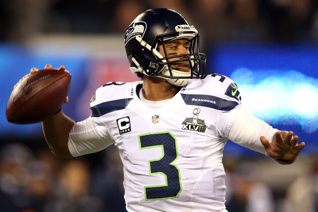 EAST RUTHERFORD, NJ - FEBRUARY 02:  Quarterback Russell Wilson #3 of the Seattle Seahawks looks to pass against the Denver Broncos during Super Bowl XLVIII at MetLife Stadium on February 2, 2014 in East Rutherford, New Jersey.  (Photo by Jeff Gross/Getty Images)