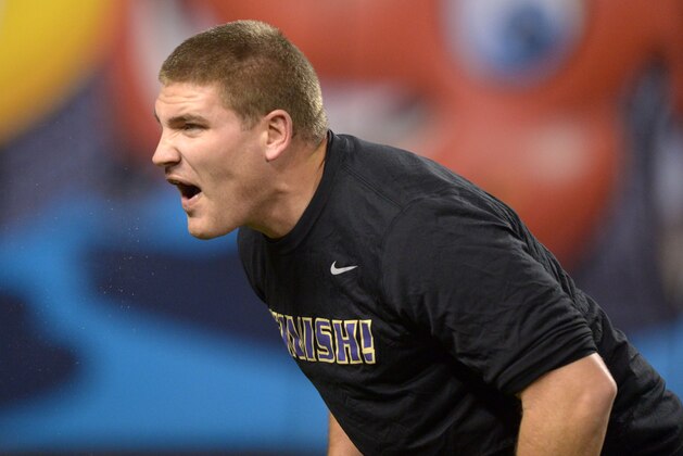 Dec 27, 2013; San Francisco, CA, USA; Washington Huskies coach Tosh Lupoi before the 2013 Fight Hunger Bowl against the BYU Cougars at AT&T Park. Mandatory Credit: Kirby Lee-USA TODAY Sports