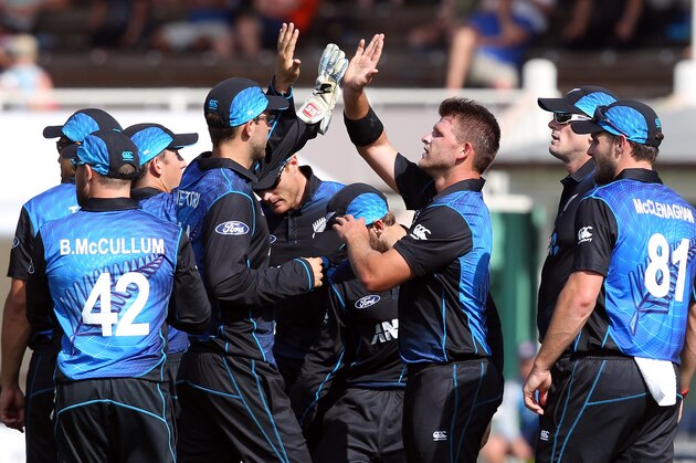 DUNEDIN, NEW ZEALAND - JANUARY 25: Corey Anderson of New Zealand celebrates taking the wicket of Dimuth Karunaratne of Sri Lanka with his team-mates during the One Day International match between New Zealand and Sri Lanka at University Oval on January 25, 2015 in Dunedin, New Zealand.  (Photo by Rob Jefferies/Getty Images)