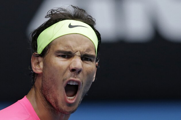 Rafael Nadal of Spain yells as he plays against Kevin Anderson of South Africa during their fourth round match at the Australian Open tennis championship in Melbourne, Australia, Sunday, Jan. 25, 2015. (AP Photo/Bernat Armangue)