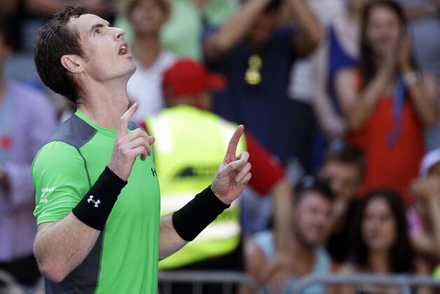 Andy Murray of Britain celebrates after defeating Joao Sousa of Portugal during their third round match at the Australian Open tennis championship in Melbourne, Australia, Friday, Jan. 23, 2015. (AP Photo/Lee Jin-man)