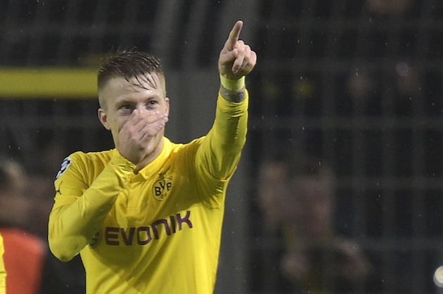Dortmund's Marco Reus celebrates after scoring the opening goal during the Champions League group D soccer match between Borussia Dortmund and Galatasaray Istanbul in Dortmund, Germany, Tuesday, Nov.4,,2014. (AP Photo/Martin Meissner)