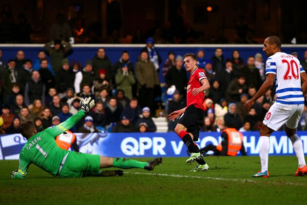 LONDON, ENGLAND - JANUARY 17:  James Wilson of Manchester United scores his team's second goal past Robert Green of QPR during the Barclays Premier League match between Queens Park Rangers and Manchester United at Loftus Road on January 17, 2015 in London, England.  (Photo by Mark Thompson/Getty Images)