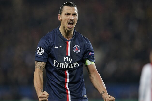 PSG's Zlatan Ibrahimovic celebrates after scoring during the Champions League Group F soccer match between Paris Saint Germain and Ajax at the Parc des Princes stadium in Paris, France, Tuesday, Nov. 25, 2014. (AP Photo/Christophe Ena)