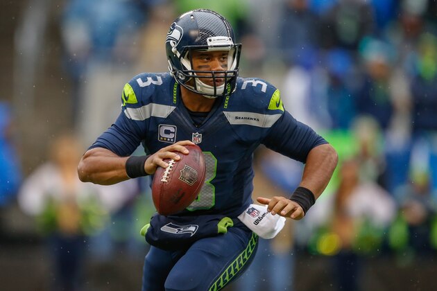 SEATTLE, WA - NOVEMBER 02:  Quarterback Russell Wilson #3 of the Seattle Seahawks rolls out to pass against the Oakland Raiders at CenturyLink Field on November 2, 2014 in Seattle, Washington.  (Photo by Otto Greule Jr/Getty Images)