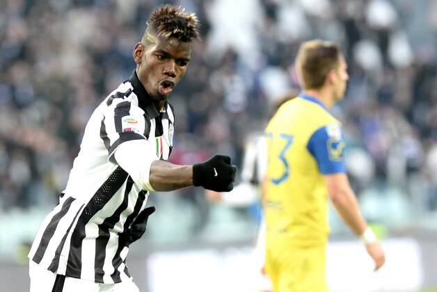 Juventus' Paul Pogba celebrates after scoring during a Serie A soccer match between Juventus and Chievo Verona at the Juventus stadium, in Turin, Italy, Sunday, Jan. 25, 2015. (AP Photo/Massimo Pinca)