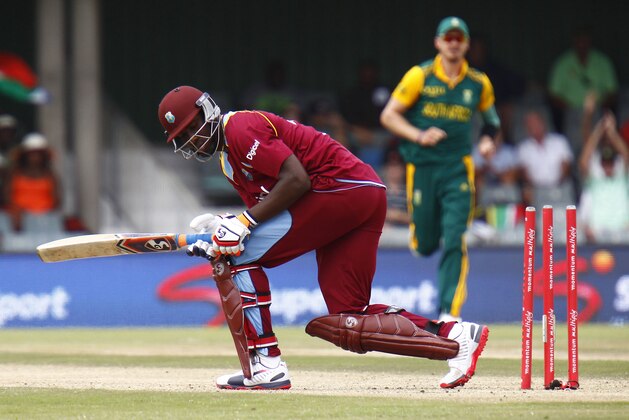 West Indies' Andre Russell is bowled out during their one day international cricket match against South Africa in East London, South Africa, Wednesday, Jan. 21, 2015. (AP Photo/Michael/Sheehan)