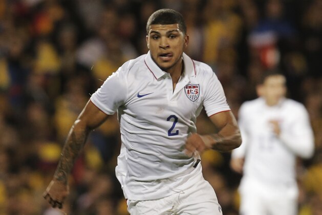 USA's DeAndre Yedlin runs with the ball during an international friendly soccer match against Colombia at the Craven Cottage ground in London, Friday, Nov. 14, 2014. Colombia won the match 2-1.(AP Photo/Lefteris Pitarakis)