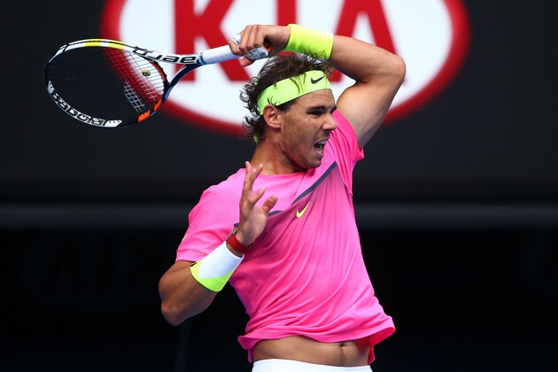 MELBOURNE, AUSTRALIA - JANUARY 25:  Rafael Nadal of Spain plays a backhand in his fourth round match against Kevin Anderson of South Africa during day seven of the 2015 Australian Open at Melbourne Park on January 25, 2015 in Melbourne, Australia.  (Photo by Clive Brunskill/Getty Images)