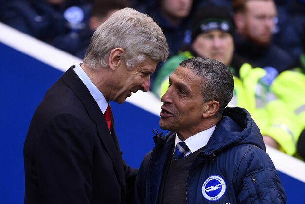 BRIGHTON, ENGLAND - JANUARY 25:  Chris Hughton, manager of Brighton shakes hands with Arsene Wenger, manager of Arsenal before the FA Cup Fourth Round match between Brighton & Hove Albion and Arsenal at Amex Stadium on January 25, 2015 in Brighton, England.  (Photo by Mike Hewitt/Getty Images)