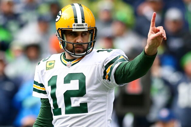 SEATTLE, WA - JANUARY 18: Aaron Rodgers #12 of the Green Bay Packers reacts during the first quarter of the 2015 NFC Championship game against the Seattle Seahawks at CenturyLink Field on January 18, 2015 in Seattle, Washington.  (Photo by Ronald Martinez/Getty Images)