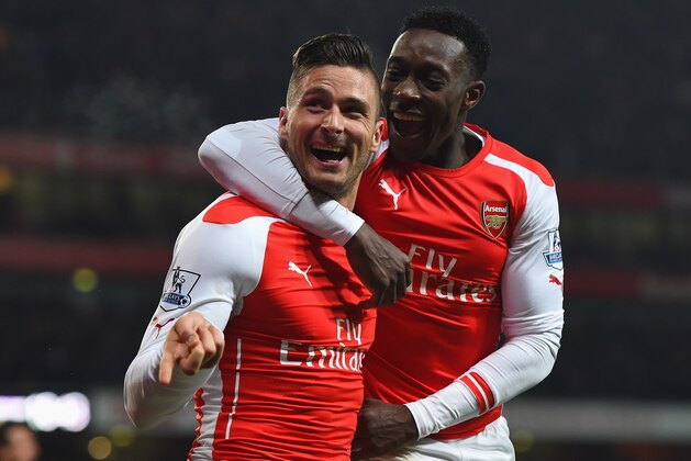 LONDON, ENGLAND - DECEMBER 13:  Olivier Giroud of Arsenal celebrates scoring his team's third goal with Danny Welbeck during the Barclays Premier League match between Arsenal and Newcastle United at Emirates Stadium on December 13, 2014 in London, England.  (Photo by Paul Gilham/Getty Images)