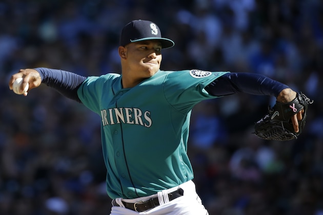 Seattle Mariners pitcher Taijuan Walker throws against the Oakland Athletics in a baseball game, Sunday, Sept. 14, 2014, in Seattle. (AP Photo/Ted S. Warren)