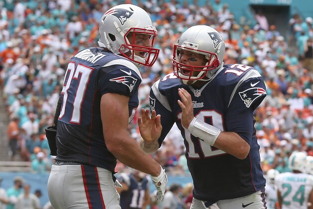 MIAMI GARDENS, FL - SEPTEMBER 07:  Rob Gronkowski #87 of the New England Patriots celebrates his second quarter touchdown with  Tom Brady #12 during a game against the Miami Dolphins at Sun Life Stadium on September 7, 2014 in Miami Gardens, Florida.  (Photo by Mike Ehrmann/Getty Images)